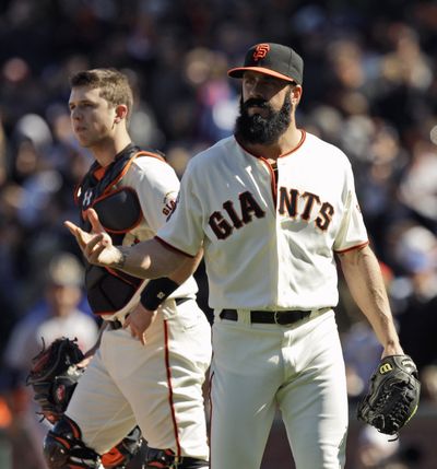 Giants closer Brian Wilson walks to the dugout after being pulled from San Francisco’s loss to Atlanta on Sunday. (Associated Press)