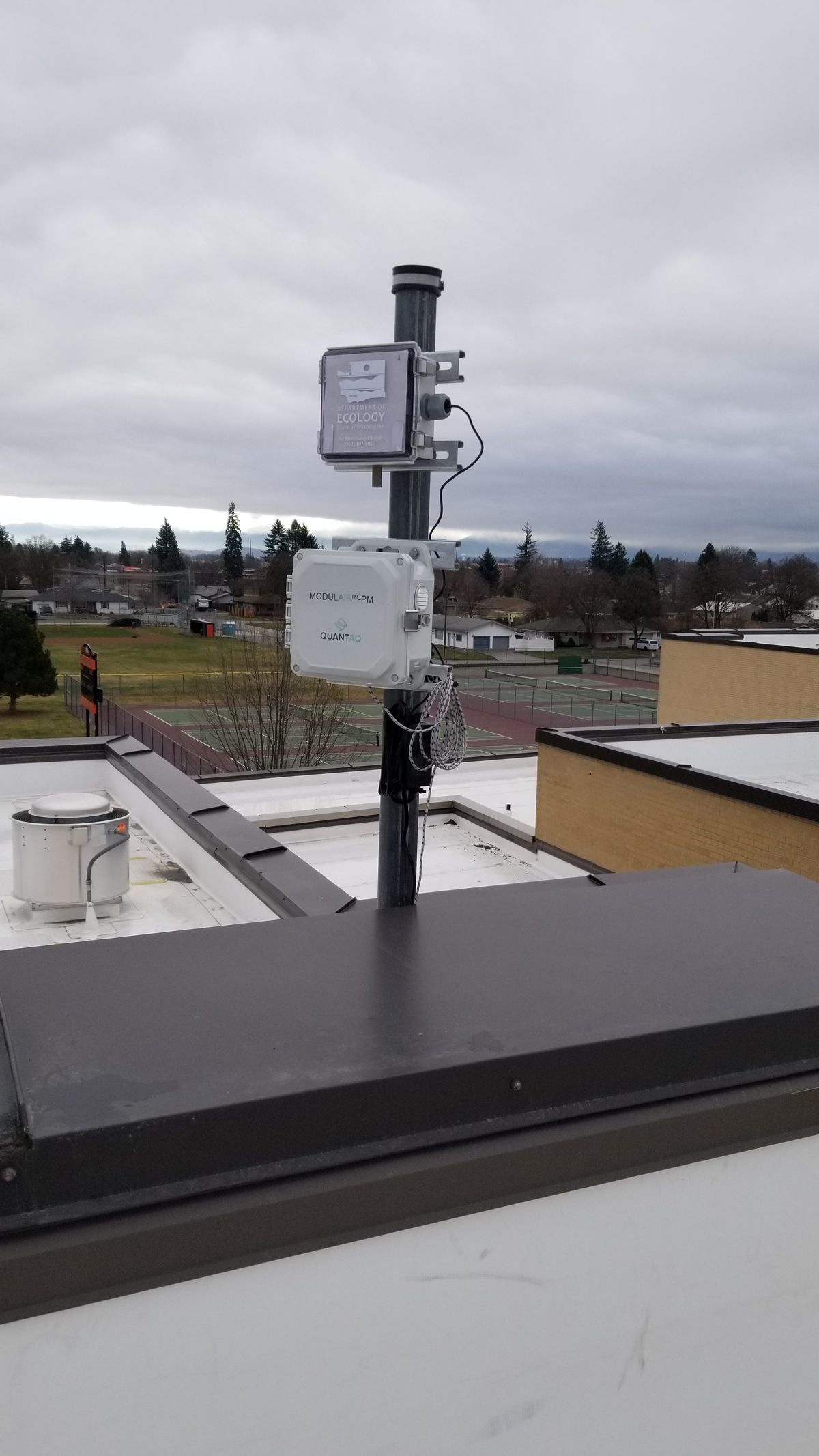A SensWA air-quality monitor, designed and developed by Washington's Department of Ecology, collects data from the roof of West Valley High School in Spokane Valley.   (Courtesy of the Spokane Regional Clean Air Agency)