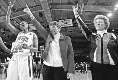 
NC State women's coach Kay Yow, center, celebrates her 700th career win win Gillian Goring, left, and assistant Stephanie Glance. 
 (Associated Press / The Spokesman-Review)