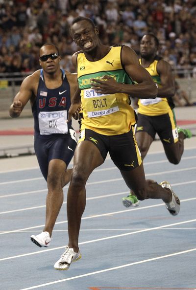 Jamaica’s Usain Bolt wins the gold in the men’s 200-meter final. (Associated Press)