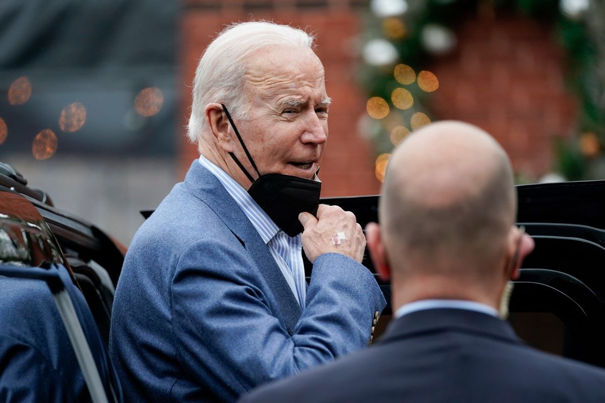 President Joe Biden speaks to members of the media as gets into his motorcade after having New Year