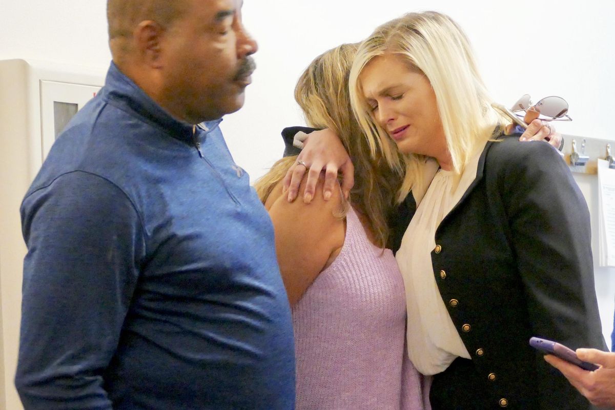 Cynthia Khaleel, right, hugs friends and family in the hallway outside the courtroom where she had just been acquitted, Tuesday, June 19, 2018, in the death of her five-year-old nephew, Gary Blanton III back in 2015. Khaleel had taken in the five-year-old and his siblings after the murder of their father and death of their mother. Prosecutors said she probably lost her temper and inflicted a skull fracture on the boy. She said the boy climbed a piece of furniture and fell. (Jesse Tinsley / The Spokesman-Review)