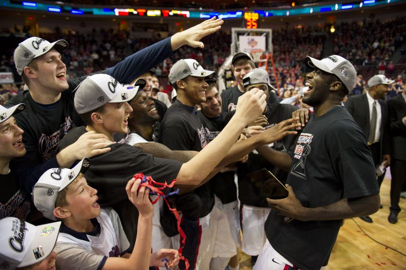 Gonzaga Bulldogs forward/center Sam Dower, far right, is congratulated by teammates after winning MVP in the Bulldog 5-64 win over BYU , Tuesday, March 11, 2014, in Las Vegas, Nevada. (The Spokesman-Review)