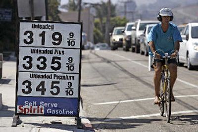 
High gas prices have helped boost energy stocks.
 (Associated Press / The Spokesman-Review)