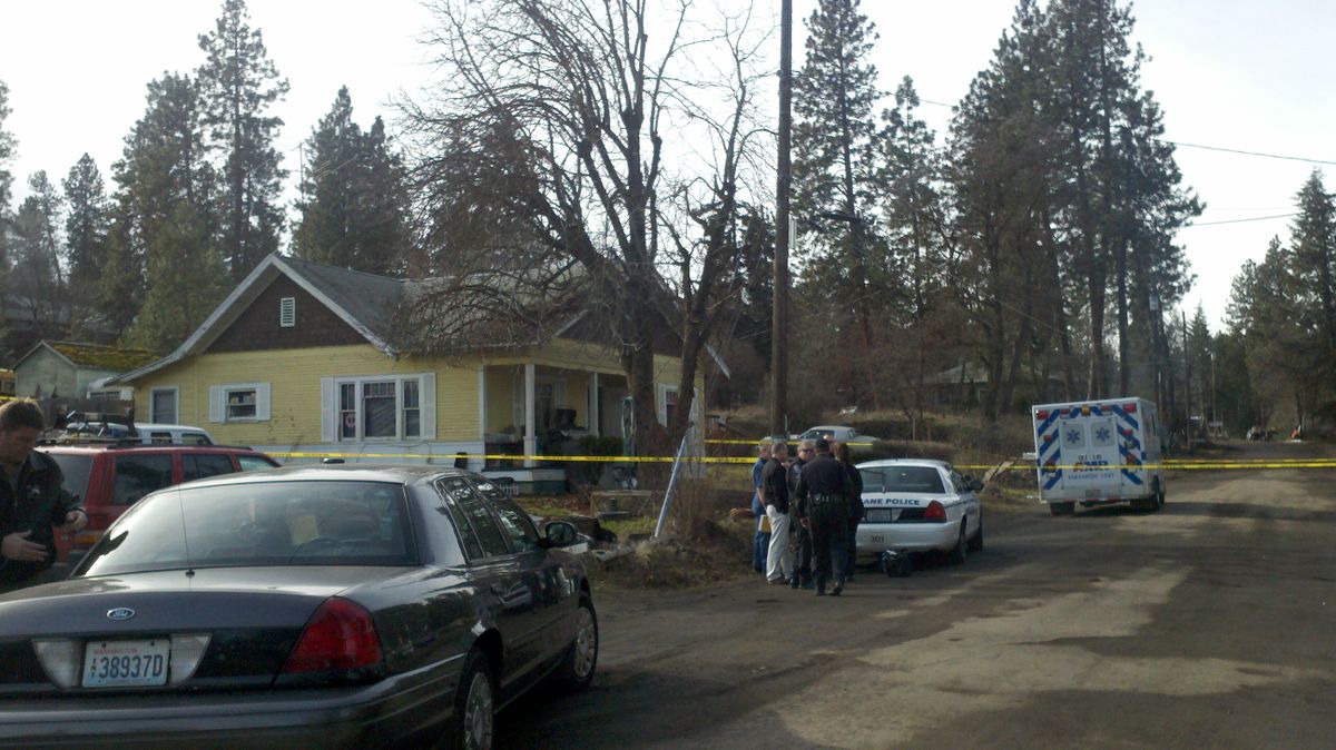 Spokane police investigate the suspicious death of a woman near Ninth Avenue and Thor Street on Wednesday afternoon, Feb. 13, 2013. (Jennifer Pignolet/The Spokesman-Review)