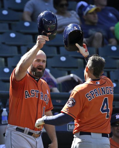 It’s hats off to George Springer, right, after ninth-inning homer. (Associated Press)