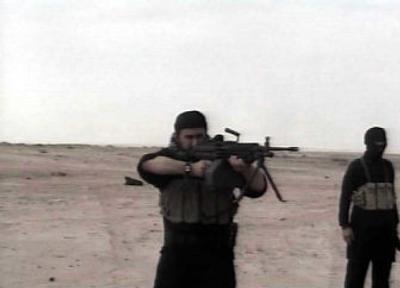 
This undated image from video, released by the U.S. military command on Thursday,  purportedly shows Abu Musab al-Zarqawi, leader of al-Qaida in Iraq, firing a machine gun.
 (Associated Press / The Spokesman-Review)