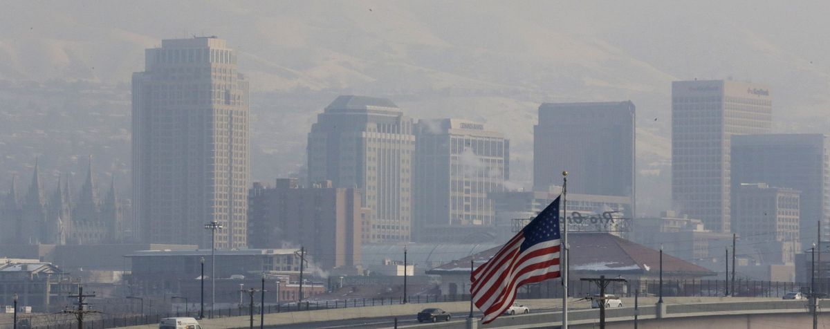 This photo from Jan. 4, shows the haze from an inversion hanging over downtown Salt Lake City. The geography that makes Utah one of the world’s most beautiful places also brings the nation’s dirtiest air in winter. (Associated Press)