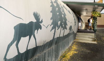 Customers leave Cabin Fever Antiques in Cheney on Aug. 7.  The business shares a long tube shaped building at 208 First St. with the Pottery Shed.  (CHRISTOPHER ANDERSON / The Spokesman-Review)