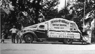 Howard Batchelder, second from left, stands with his children and his 1947 load packer garbage truck before the 1948 Fourth of July parade in Coeur d'Alene. Batchelder started Coeur d'Alene Garbage and Sanitary Disposal. Howard Batchelder, second from left, stands with his children and his 1947 load packer garbage truck before the 1948 Fourth of July parade in Coeur d'Alene. Batchelder started Coeur d'Alene Garbage and Sanitary Disposal. 
 (Family photoFamily photo / The Spokesman-Review)