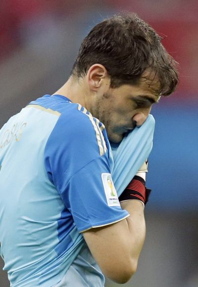 Iker Casillas said “the commitment wasn’t there” after Spain became the first title holder to exit after two games. (Associated Press)