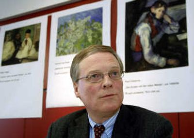 
Lukas Gloor, director of the E. G. Buehrle Collection, gives a press conference in Zurich on Monday after an armed gang stole four paintings by major artists from the private museum. Reproductions of stolen paintings seen behind, from left, are by Degas, van Gogh and Cezanne. Associated Press
 (Associated Press / The Spokesman-Review)