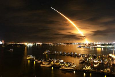 
The space shuttle Discovery streaks across the sky over Daytona Beach, Fla., after liftoff from Kennedy Space Center on Saturday.
 (Associated Press / The Spokesman-Review)