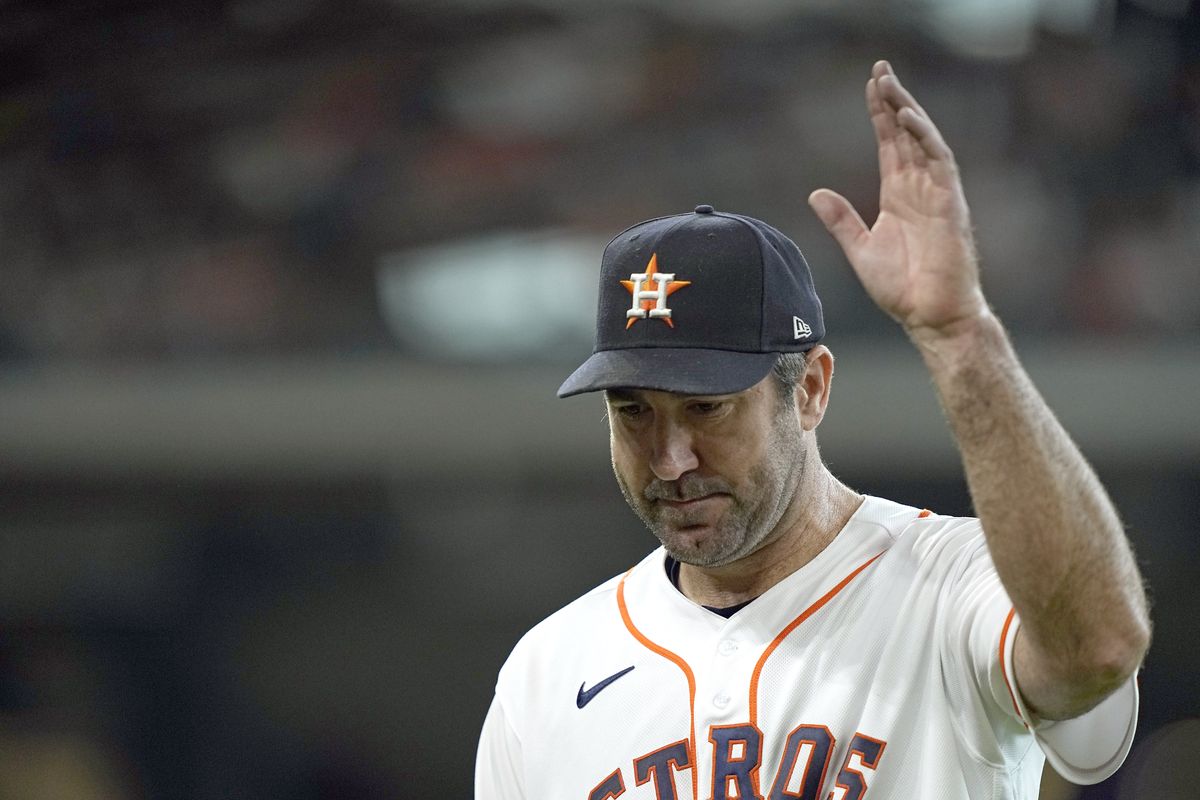 Houston Astros starting pitcher Justin Verlander acknowledges the crowd as he leaves the field during the seventh inning of a baseball game against the Seattle Mariners Wednesday, May 4, 2022, in Houston.  (David J. Phillip)