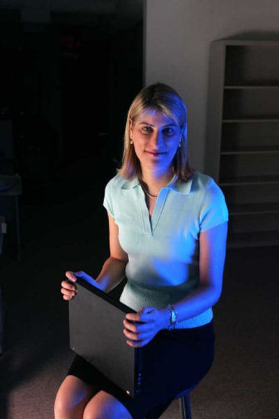 
Rensselaer Polytechnic Institute professor Mariana Figueiro is lit by daylight from a window on the left and a panel of LEDs, at RPI's Lighting Research Center in Troy, N.Y. Light cues, especially blue light, help keep the clock on its daily cycle. 