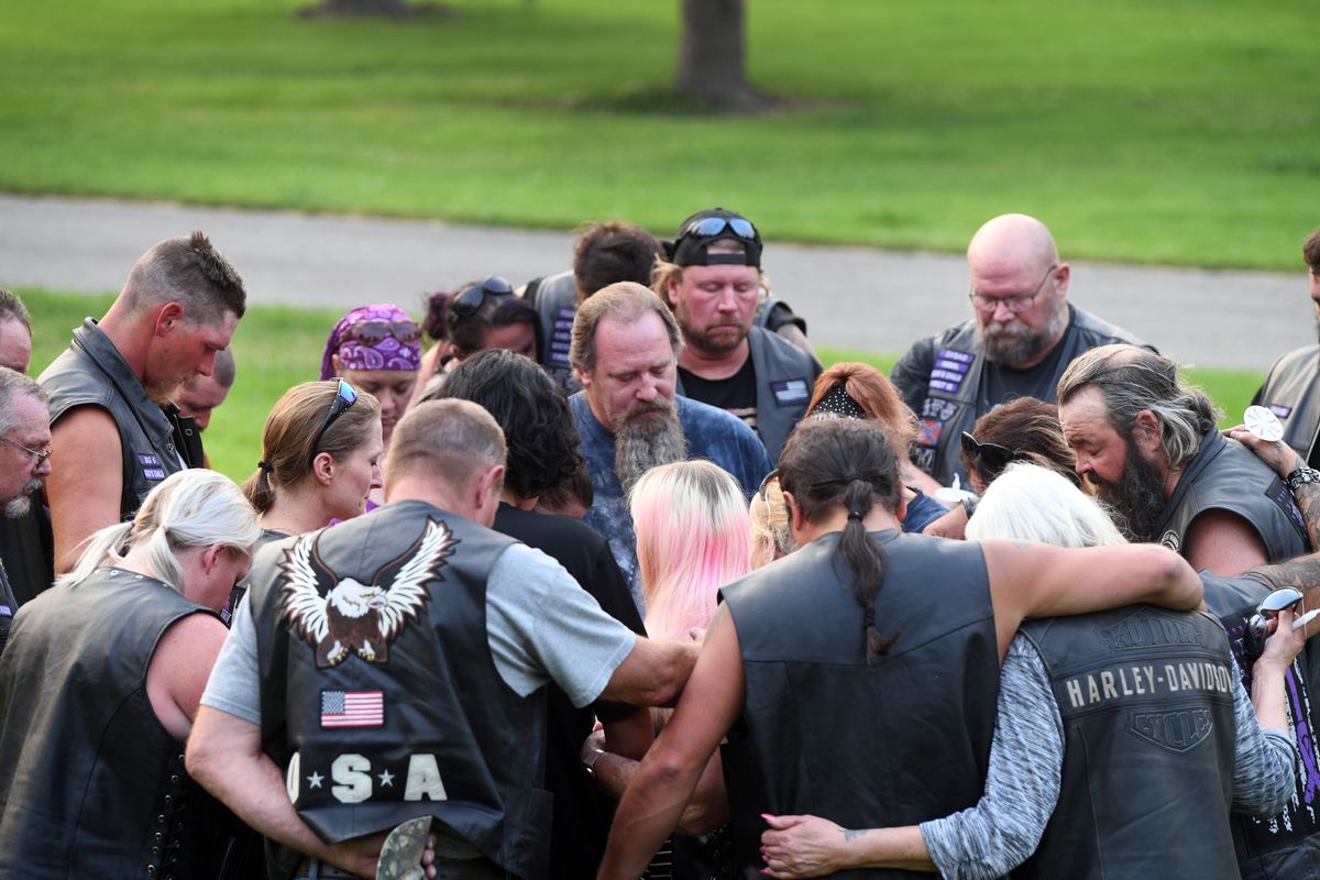 Members of the biker groups Guardians of the Children, Bikers Against Teenage Abuse and Addiction and GTS (Gone Too Soon) gather last month around the mother of Azaelia Raine RedHorse Jones at a vigil in Spokane Valley. They gathered in memory of 19-month-old Azaelia, whose death was allegedly caused by child abuse at the hands of her mother’s boyfriend.  (Jesse Tinsley/THE SPOKESMAN-REVI)