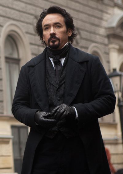 John Cusack portrays Edgar Allan Poe in a scene from “The Raven.”