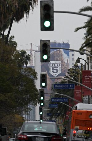In this Wednesday, April 24, 2013 photo, traffic signals are seen on Wilshire Boulevard in Los Angeles. The nation's most congested city has become a model for traffic control. With the flip of a switch earlier this year, Los Angeles became a worldwide leader by synchronizing all of its nearly 4,400 stoplights, making it the world's first major city to do so. (Reed Saxon / Associated Press)