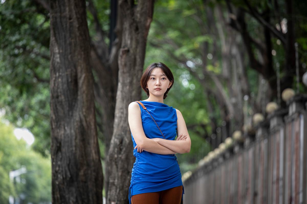 Qu Tongzhou, a photography assistant who used two popular Chinese dating apps to make friends as she went on a trip to western China, in Shanghai, Sept. 18, 2022. Beyond romance, many Chinese users find that the apps help combat loneliness as COVID lockdowns have wreaked havoc on social connections. "If I didn