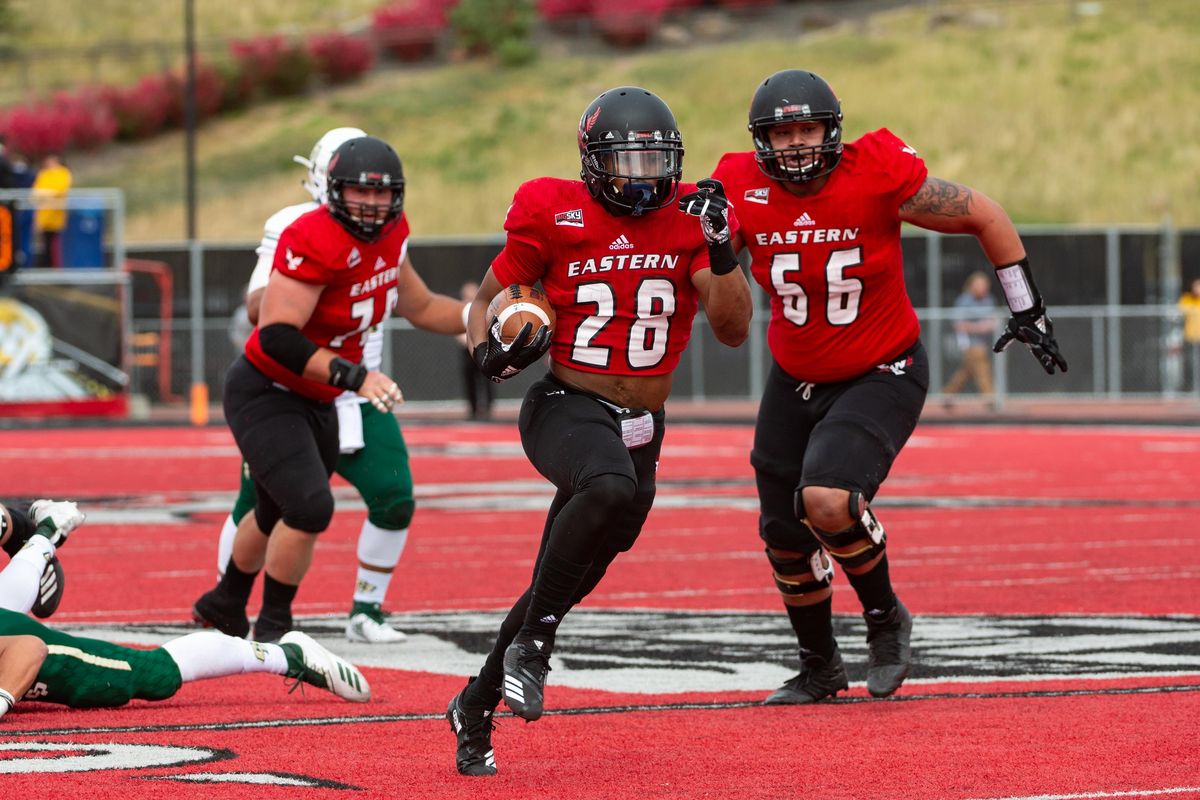 Antoine Custer Jr. (28) gains yardage during a game against CalPoly on Sept. 22 at Roos Field in Cheney, Wash. The Eastern Eagles earned their ninth highest offensive yards total at 657 yards. (Libby Kamrowski / The Spokesman-Review)