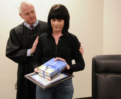 At DUI Court  graduation last week, Judge Richard White congratulates Tamra Moore for completing the program. 