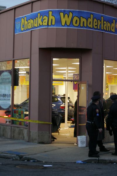 A car slammed into this  building where Orthodox Jewish families were celebrating Hanukkah, injuring 14 people.  (Associated Press / The Spokesman-Review)