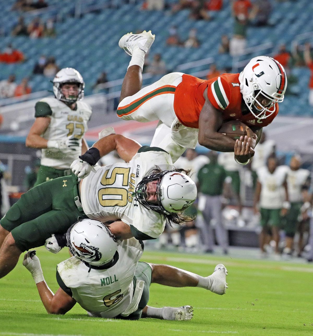 Miami quarterback D’Eriq King leaps for a second-quarter touchdown against UAB during a nonconference game Sept. 10 in Miami Gardens, Fla.  (AL DIAZ)