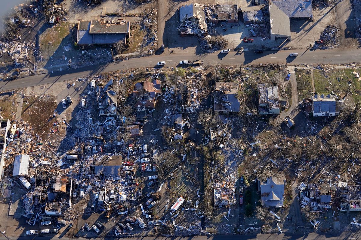 In this aerial photo, destruction from a recent tornado is seen in downtown Mayfield, Ky., Sunday, Dec. 12, 2021.  (Gerald Herbert)