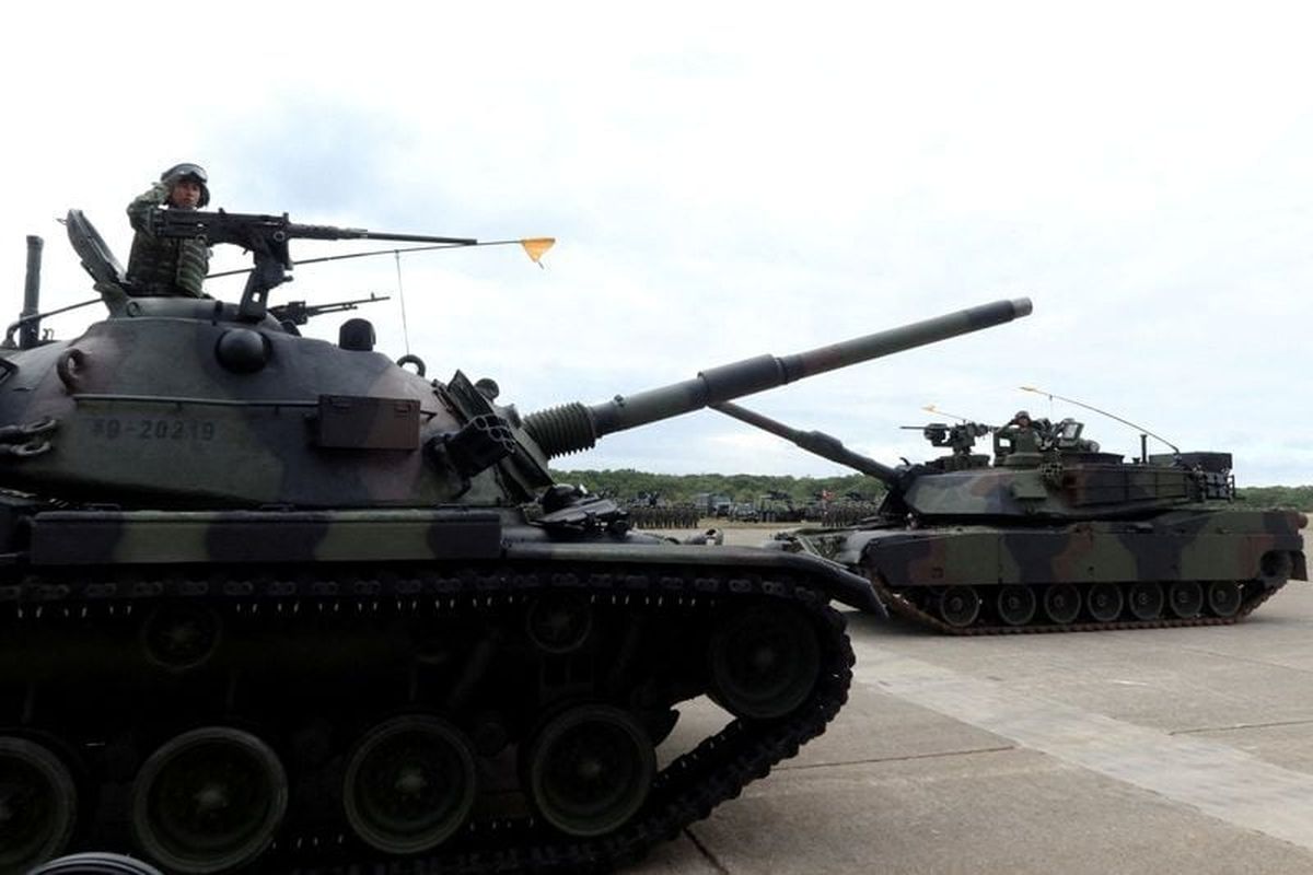 A CM-11 Brave Tiger tank and an M1A2T Abrams tank take part in a commissioning ceremony for Taiwan
