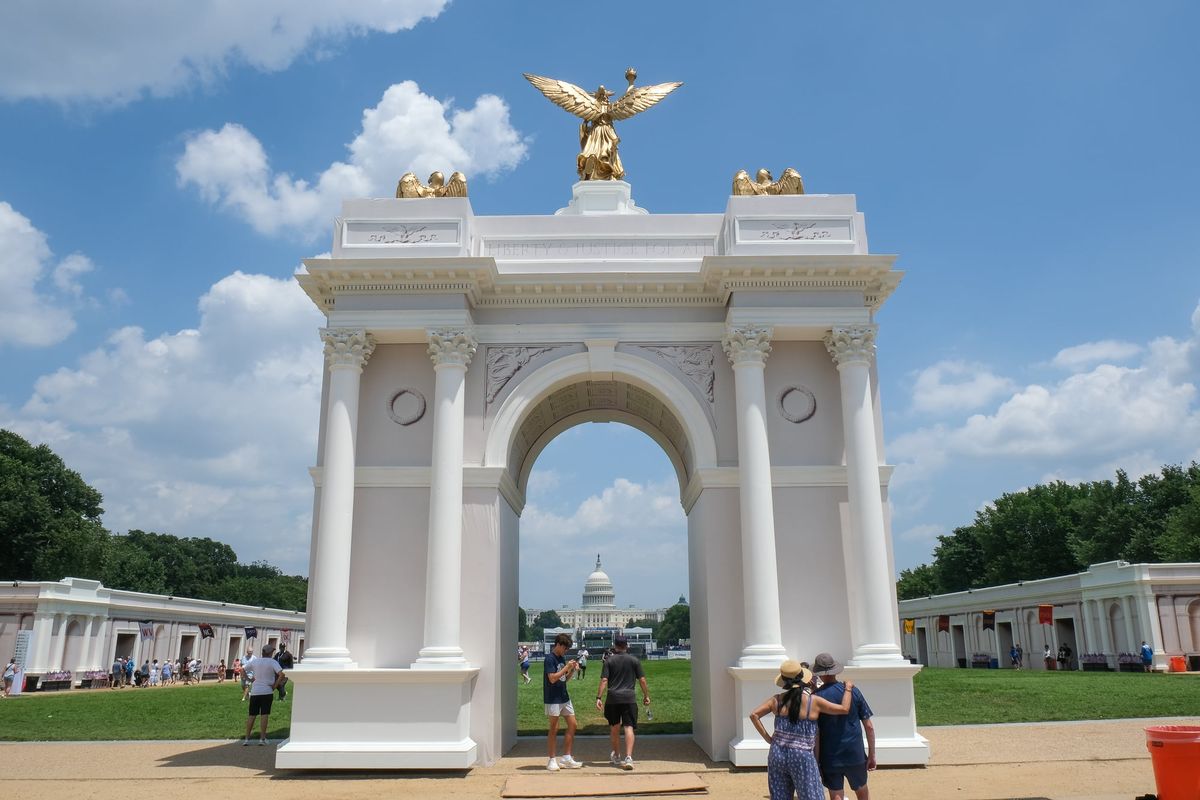 A model of the triumphal arch President Donald Trump wants to build near Arlington National Cemetery stands on the National Mall on July 1 as part of the Great American State Fair, organized to mark the United States’ 250th anniversary of independence.  (Orion Donovan Smith/The Spokesman-Review)
