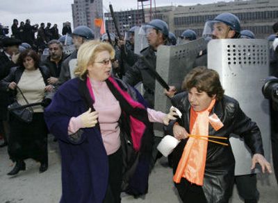 
Club-wielding police officers disperse opposition demonstrators Saturday in Baku, Azerbaijan. 
 (Associated Press / The Spokesman-Review)
