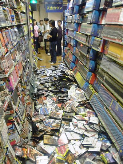 
Packages of DVDs are scattered on the floor at a video shop in Tokyo after a magnitude 6.0 earthquake rocked the area Saturday. 
 (Associated Press / The Spokesman-Review)