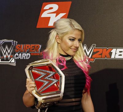 In this Aug. 18, 2017, file photo, WWE Superstar Alexa Bliss is seen at the WWE 2K18 SummerSlam Kickoff Event in New York. Bliss ditched her skimpy two-piece ring gear that helped make the former WWE champ one of the more alluring wrestlers in the company for a full bodysuit. Performing for the first time in the United Arab Emirates, where strict rules apply to how much of the body a woman can bare in public, Bliss wasn’t about to risk offending a nation that was set to have WWE female wrestlers fight on the same card as the men. (Adam Hunger / Invision for 2K Games/AP Images)
