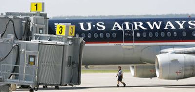 
A diverted US Airways plane sits next to the terminal at  Oklahoma City. 
 (Associated Press / The Spokesman-Review)