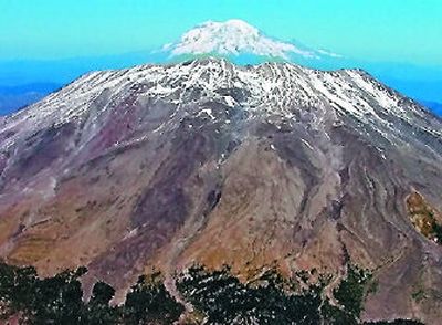 
 Mount St. Helens, in the foreground, is shown with Mt. Rainier in the background in this Sept. 27, 2004, file photo. A Spokane-based mining company wants to explore the possibility of mining on land at the edge of the national monument, and that has ignited a preservation fight.
 (File Associated Press / The Spokesman-Review)