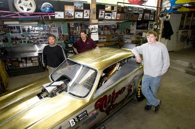 From left, Chris Davis, Ken Landrus  and Drew Davis helped build a top fuel funny car called Nitro Pimp.  (Colin Mulvany / The Spokesman-Review)