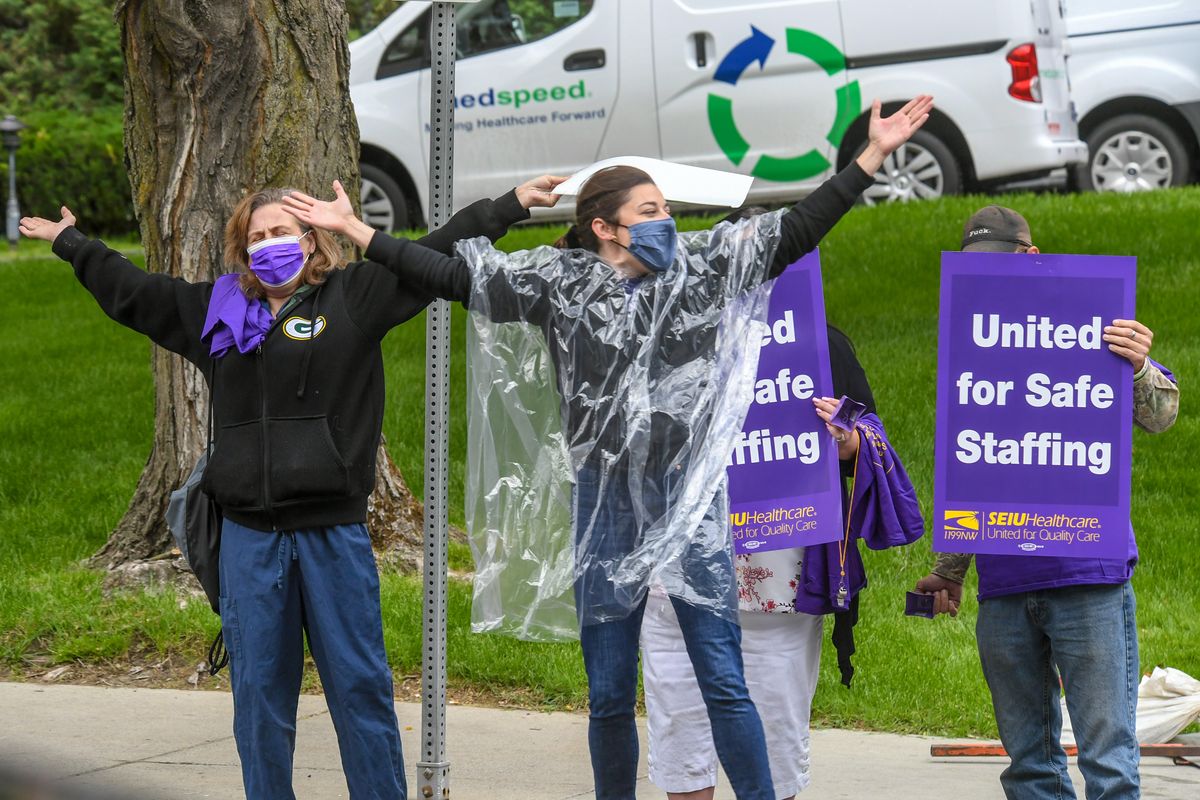 Healthcare workers gather and dance to the disco song "YMCA" outside Multi-Care Deaconess Hospital in Spokane, Wednesday, May 19, 2021, for an informational picket and rally to call on MultiCare management to listen to frontline caregivers and put patients over profits.  (DAN PELLE/THE SPOKESMAN-REVIEW)