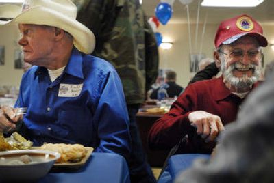 
Ronald Knutson, 70, left, and Frank Woods were among dozens of homeless veterans honored and served lunch Friday at the Union Gospel Mission on Trent  Avenue n Spokane. 
 (Jed Conklin / The Spokesman-Review)