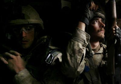 
Canadian troops ride inside an armored vehicle in Kandahar province of Afghanistan during a joint operation with the Afghan National Army recently. They are among the 32,000 NATO troops in Afghanistan. 
 (Associated Press / The Spokesman-Review)