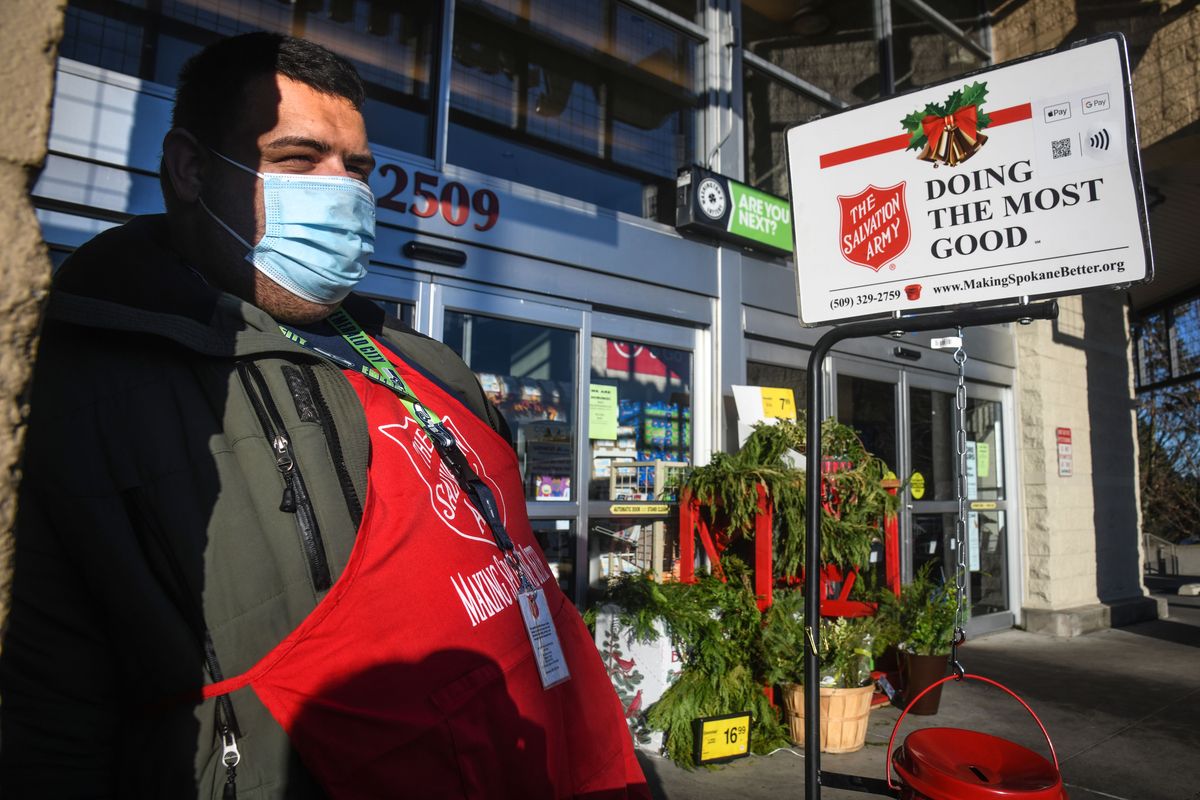 Harrison Armstrong rings the bell for The Salvation Army on Wednesday outside Safeway on 29th Avenue in Spokane.  (Dan Pelle/THESPOKESMAN-REVIEW)