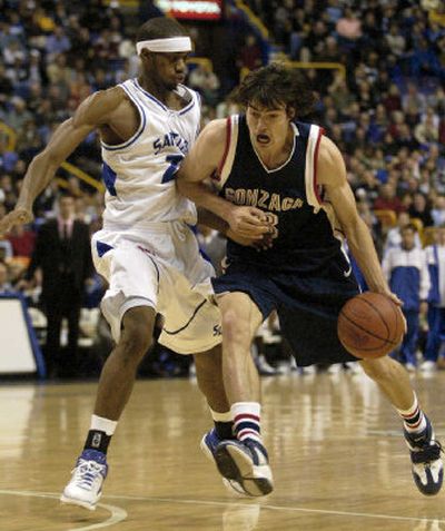 Gonzaga's Adam Morrison drives past Tommie Liddell of Saint Louis during Thursday's second half, when the Bulldogs star accounted for 14 of his 18 points. 
 (Associated Press / The Spokesman-Review)