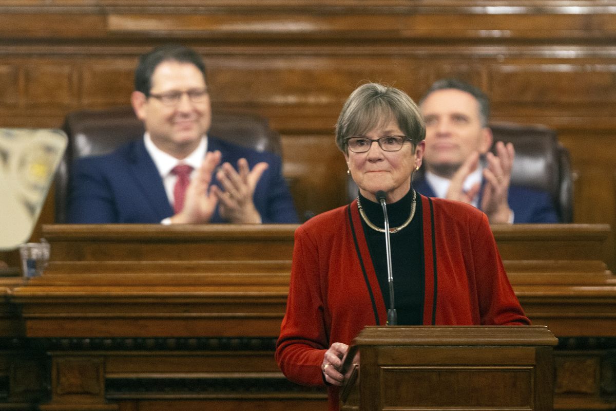 Gov. Laura Kelly is applauded as she begins addressing the Kansas Legislature for the annual State of the State, Tuesday, Jan. 11, 2022, in Topeka, Kan. Democratic and Republican governors are taking vastly different approaches to addressing the ongoing pandemic in their state of the state speeches.  (Evert Nelson)