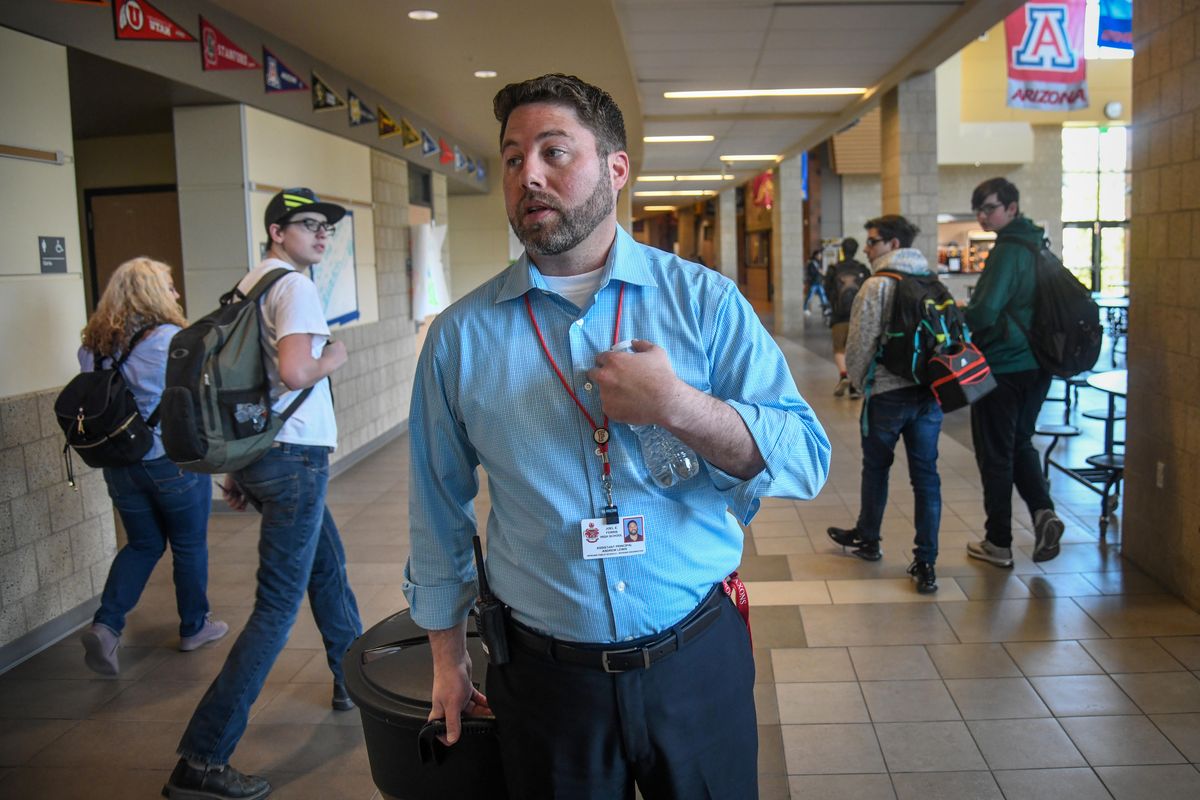 Ferris High School Assistant Principal Andrew Lewis walks down the hallway at the start of the first lunch period, Wednesday, May 8, 2019, in Spokane, Wash. (Dan Pelle / The Spokesman-Review)
