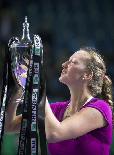 Czech Republic's Petra Kvitova lifts the trophy after winning the final of the WTA Championships against Victoria Azarenka. (Associated Press)