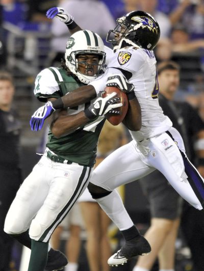 Jets wide receiver David Clowney, left, catches a TD pass.  (Associated Press / The Spokesman-Review)