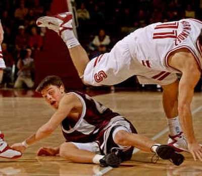 
Montana guard Brian Lynch trips up Stanford guard Chris Hernandez during the first half of Stanford's 84-66 victory.
 (Associated Press / The Spokesman-Review)