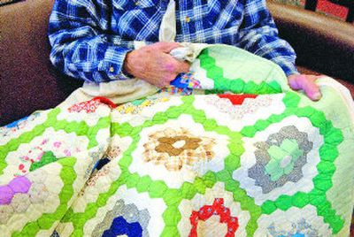 
A pattern identified as Grandmother's Flower Garden graces Slim Dossey's quilt.  
 (Ingrid Lindemann / The Spokesman-Review)
