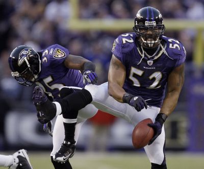 Ravens Ray Lewis, right, and Corey Ivy have their moves down as they do their turnover dance after Lewis recovers a fumble.  (Associated Press / The Spokesman-Review)