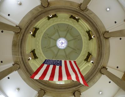 A United States flag hangs in the rotunda at the Baltimore City Hall, Tuesday, July 2, 2019, in Baltimore. (Julio Cortez / Associated Press)