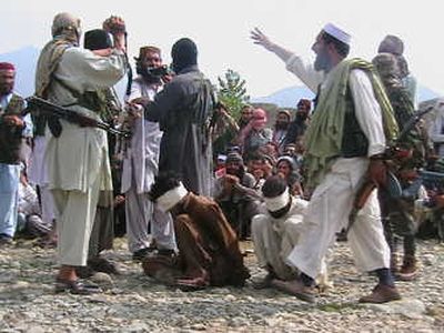 
Pakistani Taliban get ready to execute two Afghans for their alleged spying for U. S. forces and helping orchestrate a suspected American missile strike that killed 14 people in a border village.Associated Press
 (Associated Press / The Spokesman-Review)